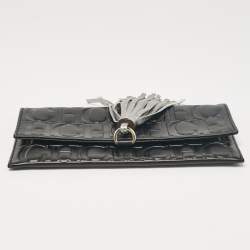 Carolina Herrera Black Monogram Embossed Leather Tassel Clutch