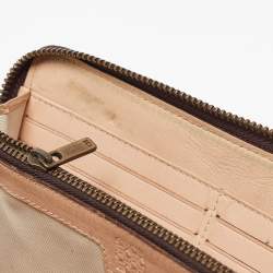 Pre Owned Carolina Herrera Brown Monogram Embossed Leather Zip Continental Wallet