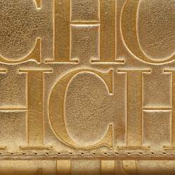 Pre Owned Carolina Herrera Gold Monogram Embossed Leather Tassel Flap Continental Wallet