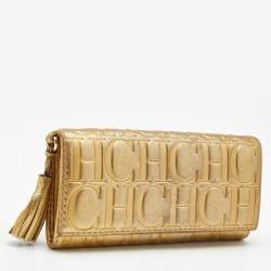 Pre Owned Carolina Herrera Gold Monogram Embossed Leather Tassel Flap Continental Wallet