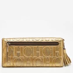 Pre Owned Carolina Herrera Gold Monogram Embossed Leather Tassel Flap Continental Wallet