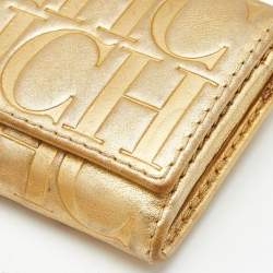 Pre Owned Carolina Herrera Gold Monogram Embossed Leather Tassel Flap Continental Wallet