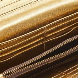 Pre Owned Carolina Herrera Gold Monogram Embossed Leather Tassel Flap Continental Wallet