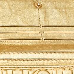 Pre Owned Carolina Herrera Gold Monogram Embossed Leather Tassel Flap Continental Wallet