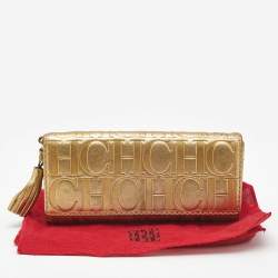 Pre Owned Carolina Herrera Gold Monogram Embossed Leather Tassel Flap Continental Wallet