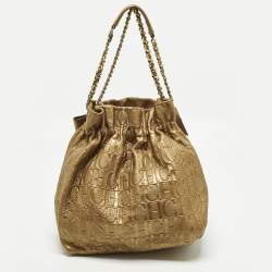 مملوكة مسبقًا Carolina Herrera Bow Gold Monogram Embossed Leather Bucket Bag