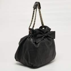 Pre Owned Carolina Herrera Bow Black Monogram Embossed Leather Bucket Bag
