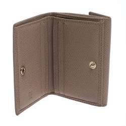 Pre Owned Carolina Herrera Beige Monogram Embossed Leather French Flap Wallet