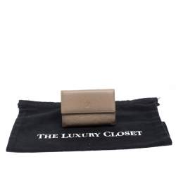 Pre Owned Carolina Herrera Beige Monogram Embossed Leather French Flap Wallet