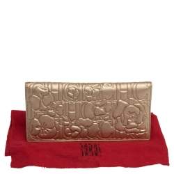 Pre Owned Carolina Herrera Metallic Gold Floral Embossed Leather Bifold Continental Wallet