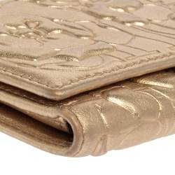 Pre Owned Carolina Herrera Gold Floral Embossed Leather Trifold Continental Wallet