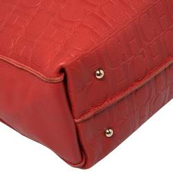 Pre Owned Carolina Herrera Red Monogram Embossed Leather Tassel Hobo
