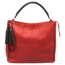 Pre Owned Carolina Herrera Red Monogram Embossed Leather Tassel Hobo