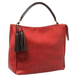 Pre Owned Carolina Herrera Red Monogram Embossed Leather Tassel Hobo