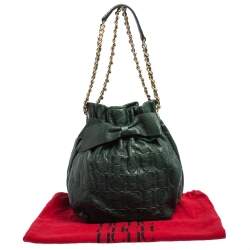 Pre Owned Carolina Herrera Dark Green Monogram Embossed Leather Bow Bucket Shoulder Bag