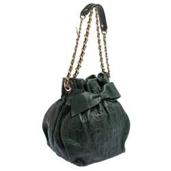 Pre Owned Carolina Herrera Dark Green Monogram Embossed Leather Bow Bucket Shoulder Bag