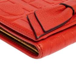 Pre Owned Carolina Herrera Orange Embossed Leather Bow Trifold Wallet
