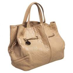 Pre Owned Carolina Herrera Beige Monogram Embossed Leather Drawstring Tote