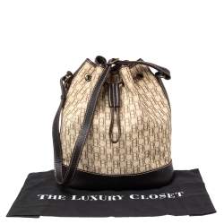 Pre Owned Carolina Herrera Brown/Beige Monogram Canvas and Leather Drawstring Bucket Bag