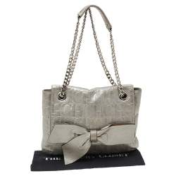 Pre Owned Carolina Herrera Silver Monogram Embossed Leather Bow Flap Shoulder Bag