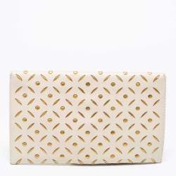 Pre Owned Carolina Herrera Off White/Gold Laser Cut Leather Tassel Clutch