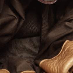 Pre Owned Carolina Herrera Gold Monogram Embossed Leather Bow Bucket Hobo