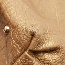 Pre Owned Carolina Herrera Gold Monogram Embossed Leather Bow Bucket Hobo