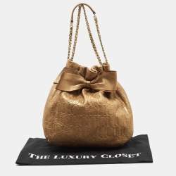 Pre Owned Carolina Herrera Gold Monogram Embossed Leather Bow Bucket Hobo