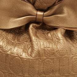 Pre Owned Carolina Herrera Gold Monogram Embossed Leather Bow Bucket Hobo