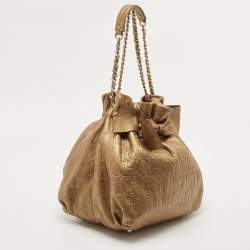 Pre Owned Carolina Herrera Gold Monogram Embossed Leather Bow Bucket Hobo