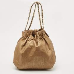 Pre Owned Carolina Herrera Gold Monogram Embossed Leather Bow Bucket Hobo