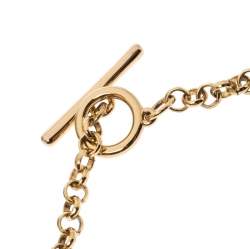 Pre Owned CH Carolina Herrera Logo Charm Gold Tone Long Toggle Pendant Necklace