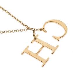 Pre Owned CH Carolina Herrera Logo Charm Gold Tone Long Toggle Pendant Necklace
