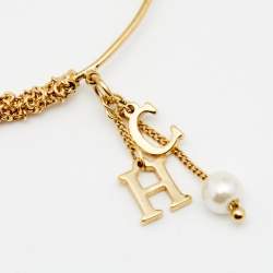 Pre Owned CH Carolina Herrera Logo and Faux Pearl Charm Gold Tone Bracelet