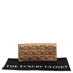 Pre Owned حقيبة كلتش سي أتش كارولينا هيريرا جلد مونوغرامي ذهبي 