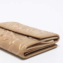 Pre Owned CH Carolina Herrera Gold Floral Embossed Leather Flap Compact Wallet