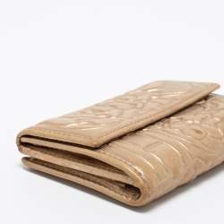 Pre Owned CH Carolina Herrera Gold Floral Embossed Leather Flap Compact Wallet