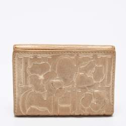 Pre Owned CH Carolina Herrera Gold Floral Embossed Leather Flap Compact Wallet