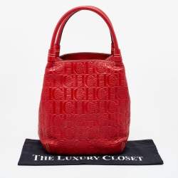 Pre Owned CH Carolina Herrera Red Monogram Embossed Leather Bucket Bag