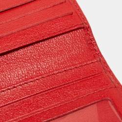Pre Owned CH Carolina Herrera Red Monogram Embossed Leather Trifold Continental Wallet