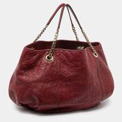 Pre Owned CH Carolina Herrera Red Monogram Embossed Leather Chain Hobo