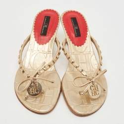 Pre Owned CH Carolina Herrera Gold Studded Leather Bow Logo Charm Thong Sandals Size 36