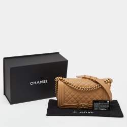 Pre Owned Chanel Beige Quilted Caviar Leather Medium Boy Flap Bag