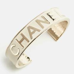 Pre Owned Chanel Logo Enamel Gold Tone Cuff Bracelet M