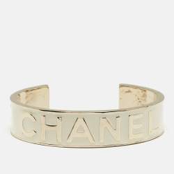 Pre Owned Chanel Logo Enamel Gold Tone Cuff Bracelet M