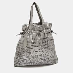 Pre Owned Chanel Silver Coated Nylon 31 Rue Cambon Graphic Drawstring Tote