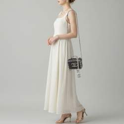 Pre Owned Chanel CC Filigree Striped Vanity Case Small Black/White Quilted Caviar Leather Bag