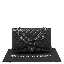 مملوكة مسبقًا حقيبة شانيل ماكسي كلاسيك جلد كافيار أسود مبطن بقلاب واحد