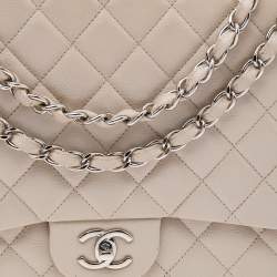 Pre Owned Chanel Beige Quilted Caviar Leather Maxi Classic Single Flap Bag