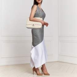 Pre Owned Chanel Beige Quilted Caviar Leather Maxi Classic Single Flap Bag